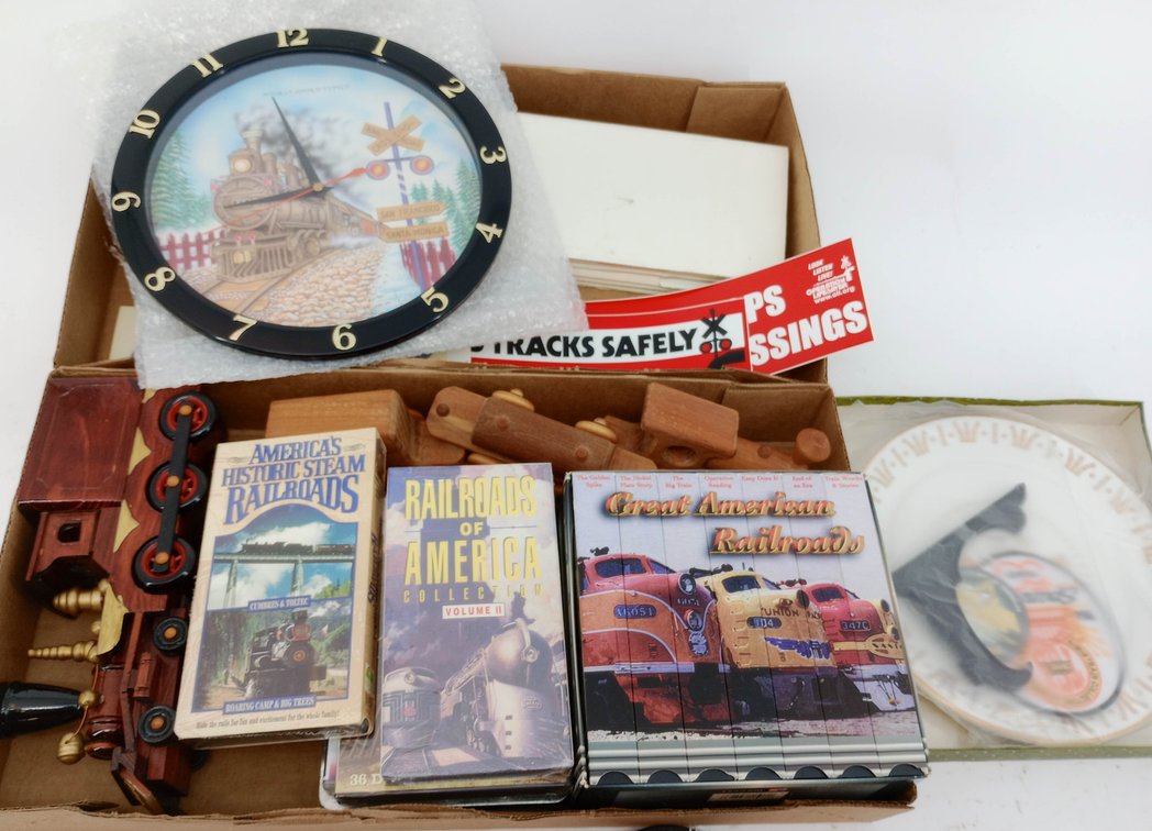 ASSORTED RAILROAD MEMORABILIA INCL AMTRAK, ACL RR PLAQUE, TRAIN CLOCK, VHS SETS & WOODEN TRAINS, TCA 50TH ANNIVERSARY PLATE PATCH AND PIN INV 263360055