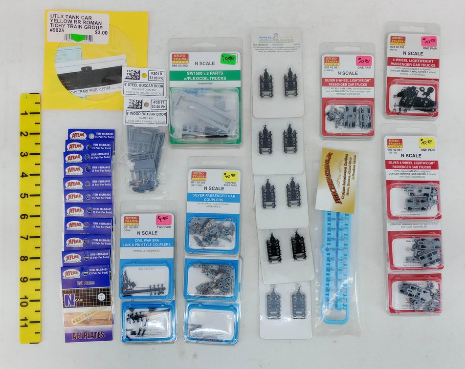 ASSORTED N SCALE MICRO-TRAINS TRUCKS, COUPLERS & ATLAS ACI PLATES  INV 263332101
