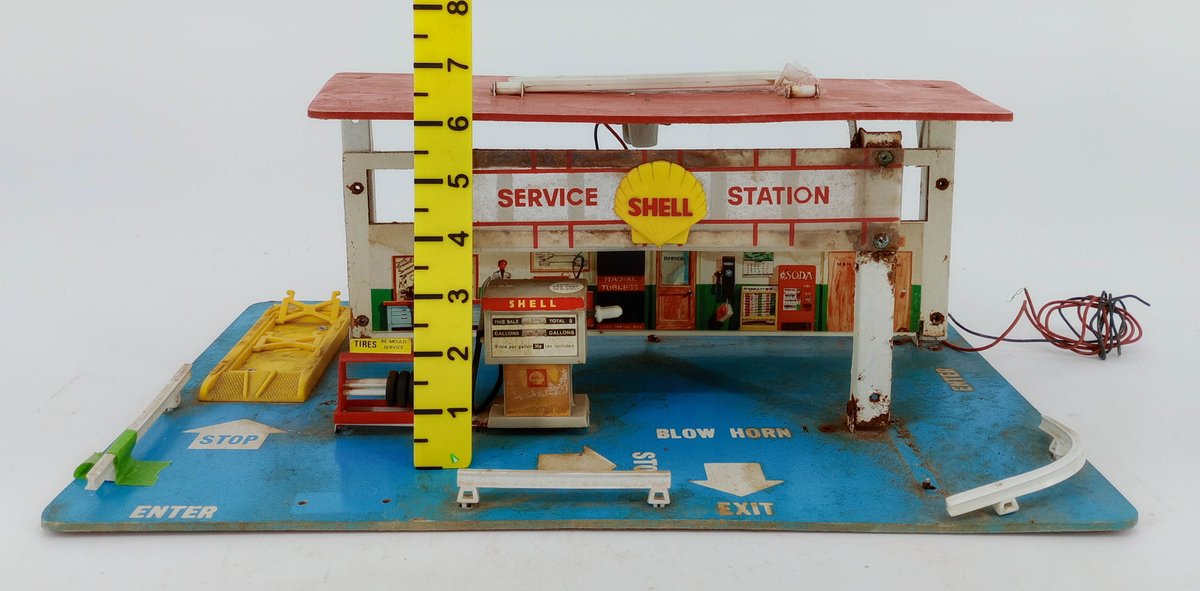 SHELL SERVICE STATION TOY PLAYSET WITH PUMP, TIRE RACK & LIFT ON BLUE BASE 11IN  INV 262350024