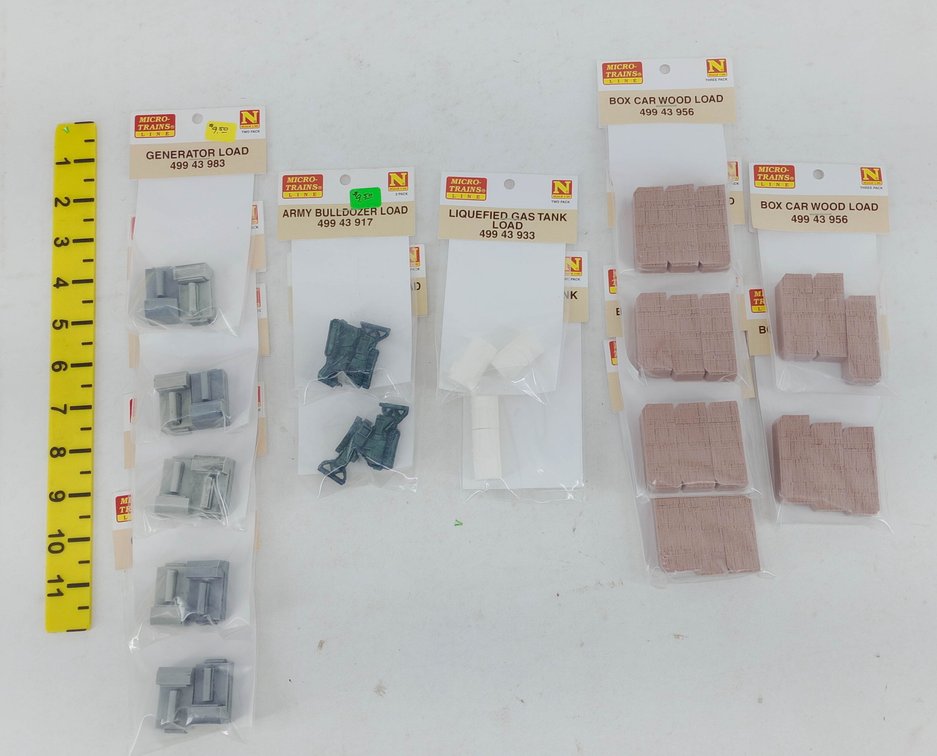 ASSORTED MICRO-TRAINS N SCALE FREIGHT CAR LOADS, GENERATOR, BULLDOZER, GAS TANK & WOOD, ALL PACKAGED  INV 263331631