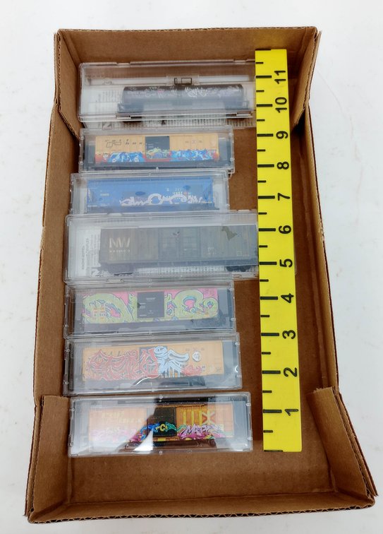7 MICRO-TRAINS N SCALE GRAFFITI FREIGHT CARS, 7 OBS  INV 263331918