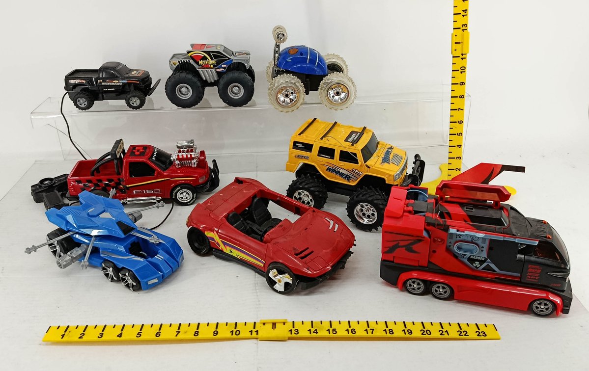 7 ASSORTED RC TOY VEHICLES HOT WHEELS WOLVERINE & SILVERADO FORD F-150 WINNER HUMMER STUNT CAR & SHOGUN TRANSFORMING TRUCK  INV 260900991