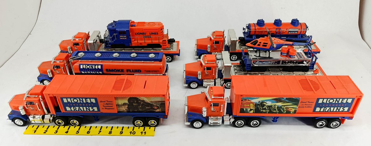 6 LIONEL 2002 TRUCK & TRAILER SETS W/ LOCOMOTIVE, TANK CAR & HELICOPTER LOADS  INV 263400029