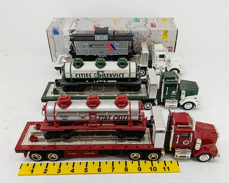3 O GAUGE FLATBED TRUCKS W/ NJ TRANSIT, CITIES SERVICE & TEXACO FIRE CHIEF RAIL CARS, 1 OB  INV 263400030