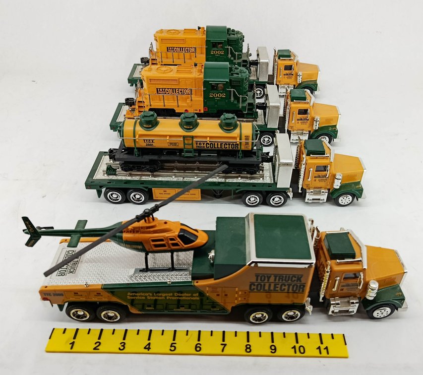 4 TOY TRUCK COLLECTOR TRUCK & TRAILER SETS W/ LOCOMOTIVES, TANK CAR & HELICOPTER  INV 263400031