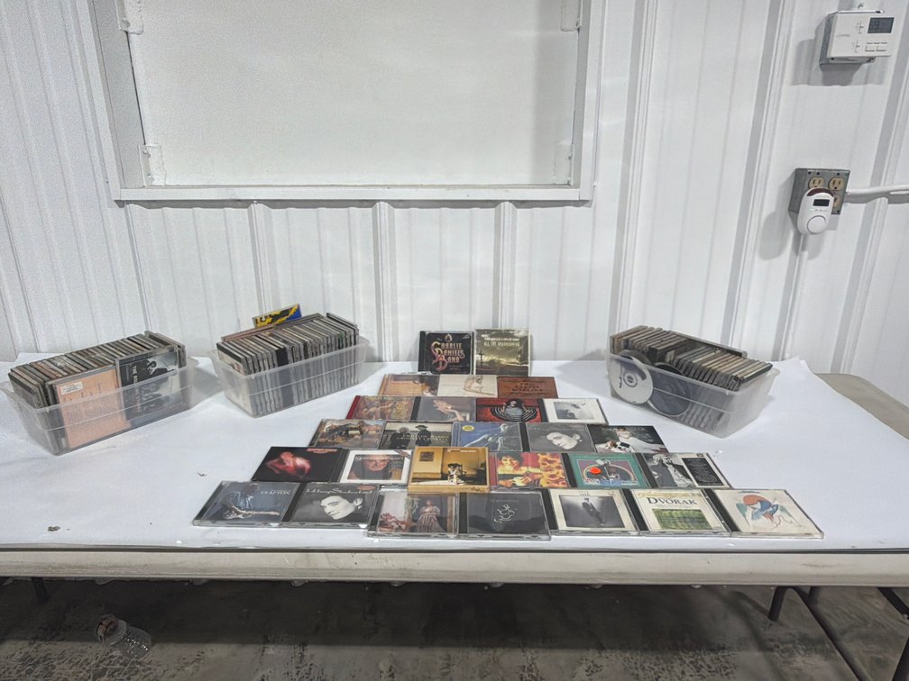 Assorted Compact Discs And Bins