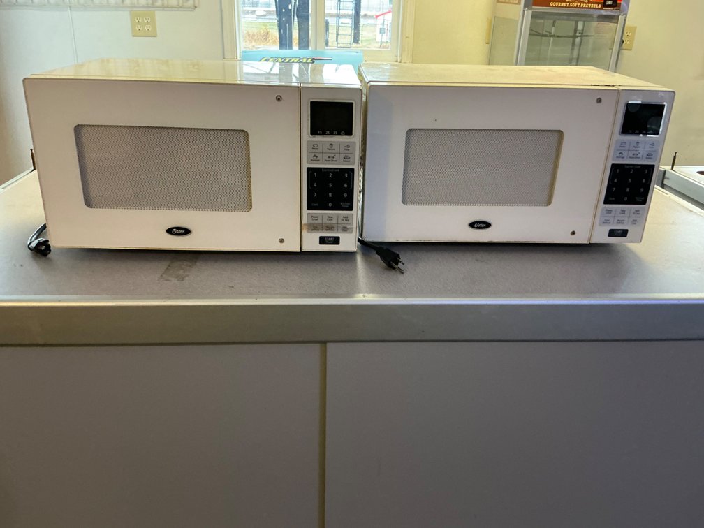 Pair Of Oster Countertop Microwave Ovens