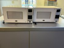 Pair Of Oster Countertop Microwave Ovens