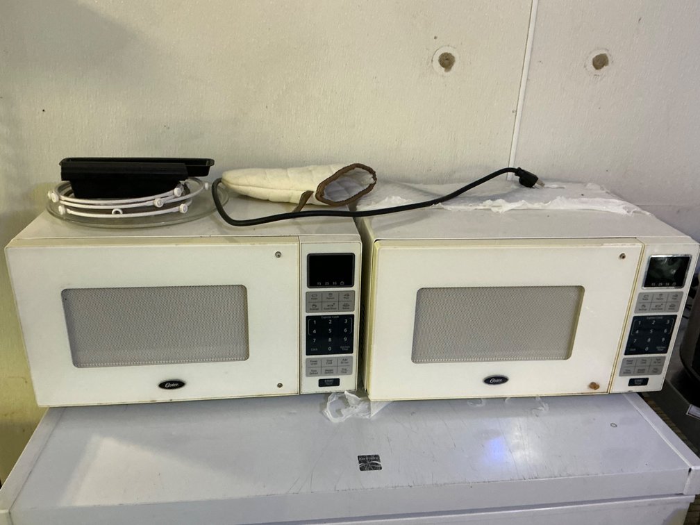 Pair Of Oster Countertop Microwave Ovens