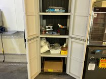 Two-Door Storage Cabinet With Supplies