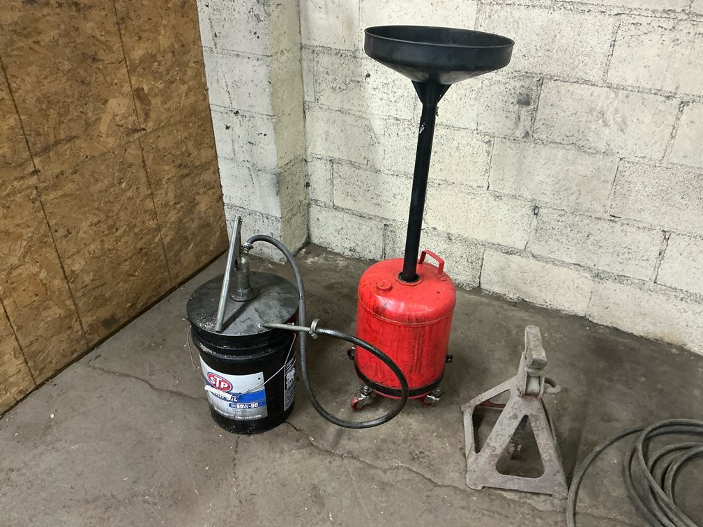 Oil Drain, Bucket Pump, And Jack Stand
