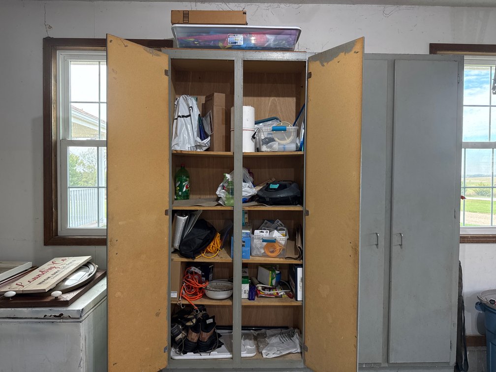 Two Door Storage Cabinet With Contents