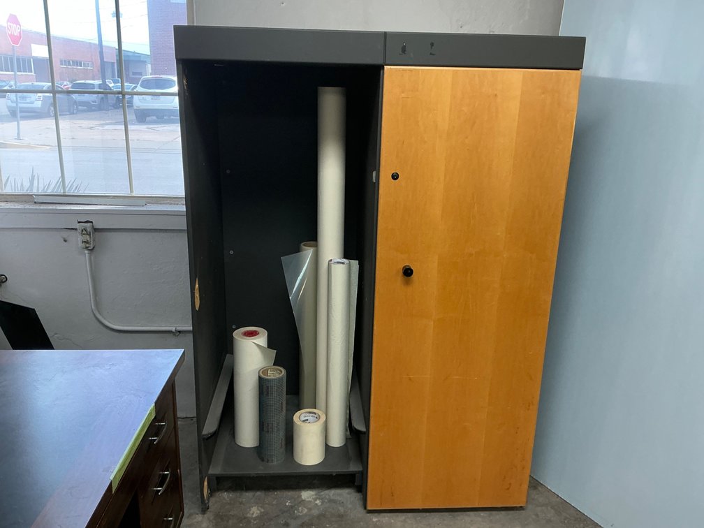 Storage Cabinet With Film And Tape Rolls