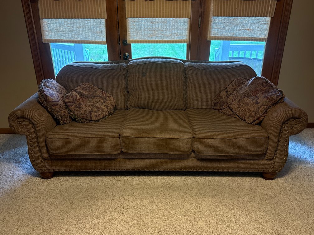 Three Cushion Upholstered Rolled Arm Sofa