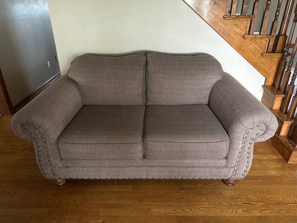 Brown Upholstered Loveseat With Nailhead Trim