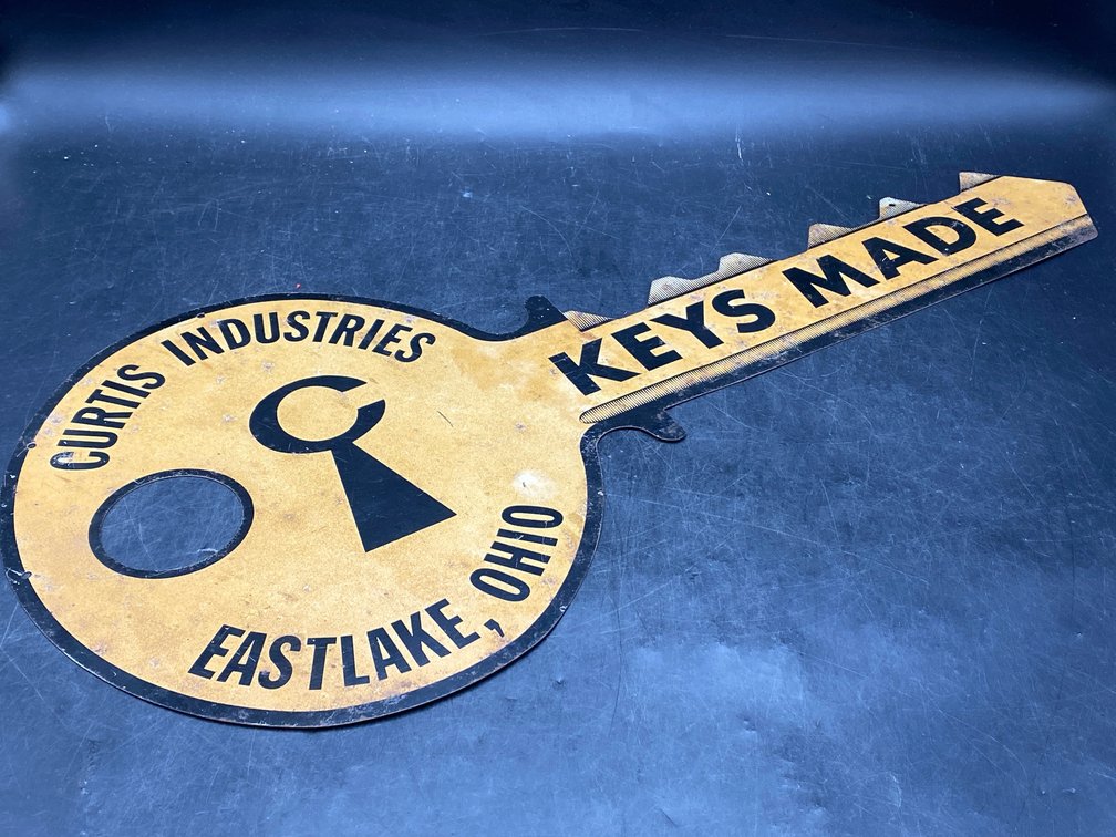 Curtis Industries Key-Shaped Tin Advertising Sign