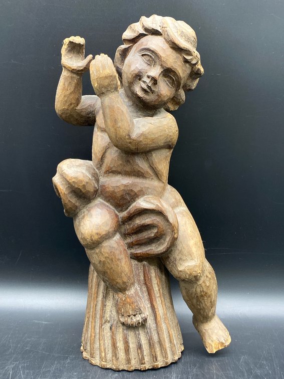 Hand-Carved Wooden Musical Infant Figurine
