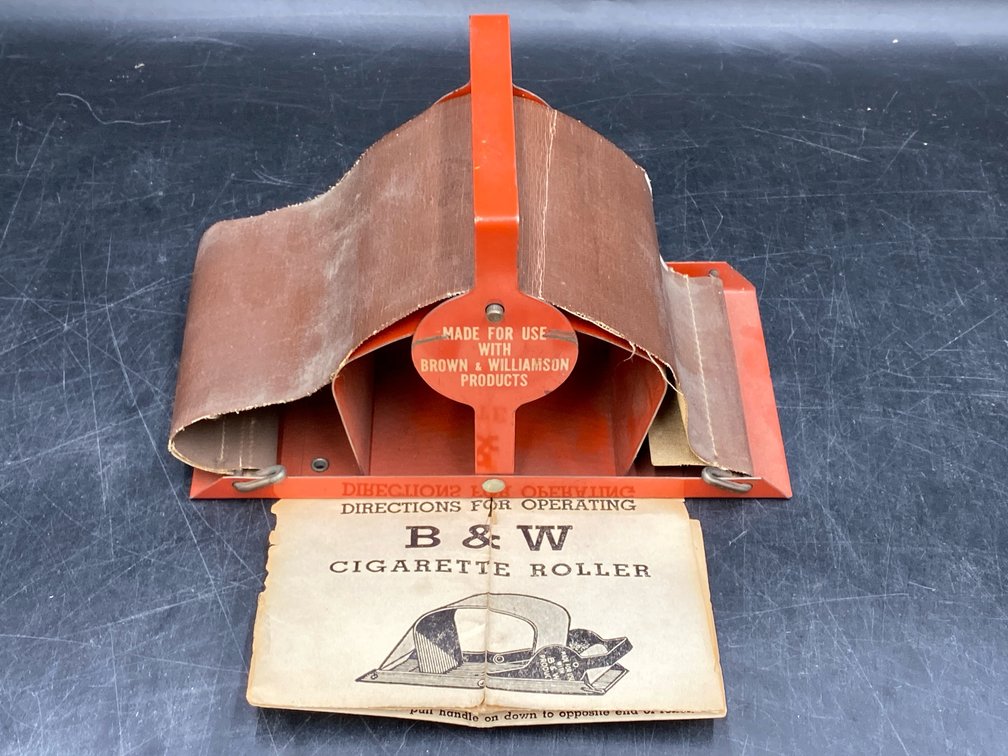 Brown & Williamson Tobacco Corp. Advertising Cigarette Rolling Machine