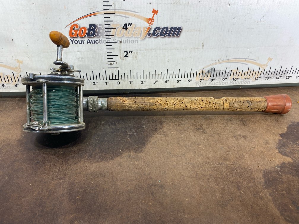 Vintage Conventional Fishing Reel on Cork Rod Handle