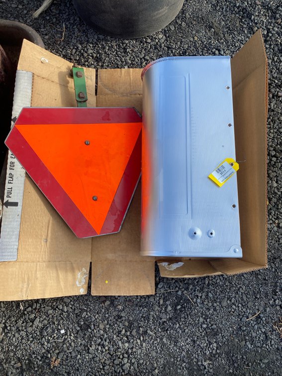Slow-Moving Vehicle Sign with Mounting Bracket and Metal Mailbox