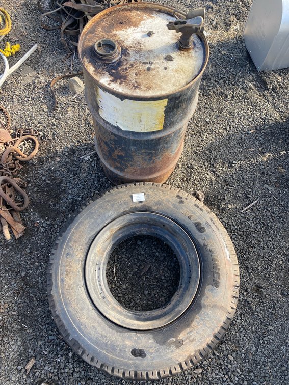 Metal Drum with Spigot and Mobile Home Tire