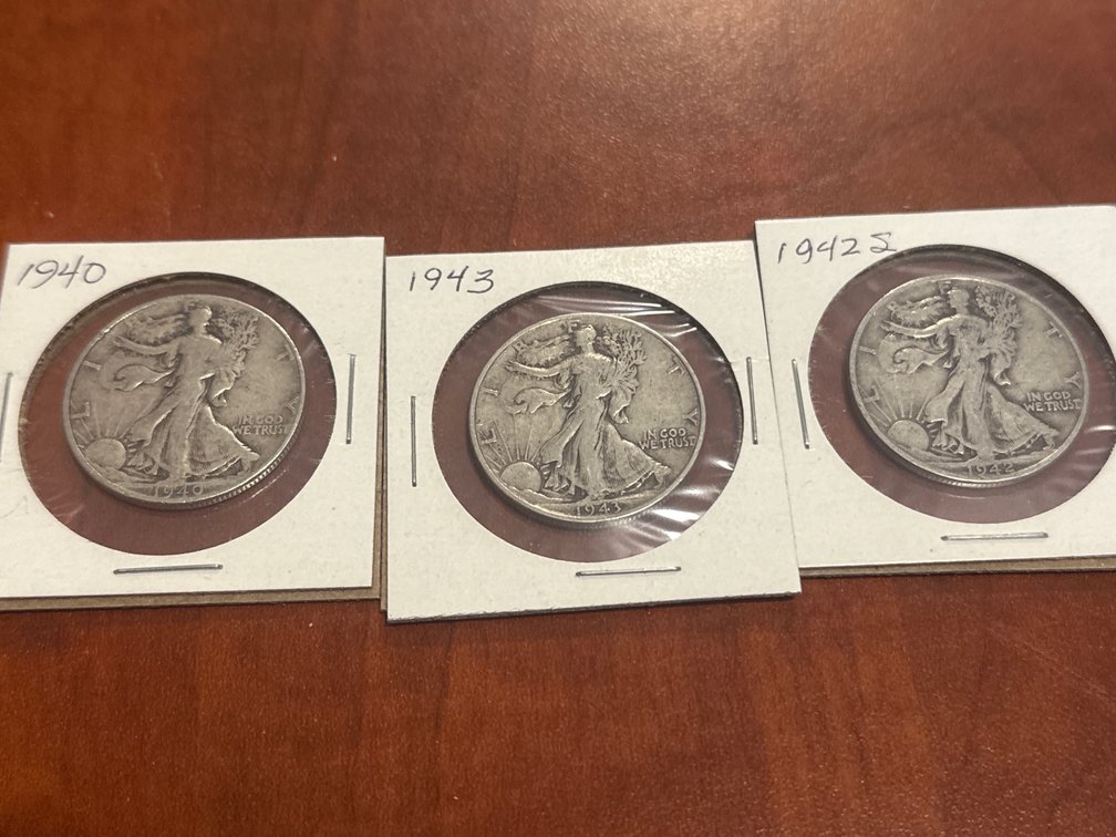Four US minted walking liberty half dollars