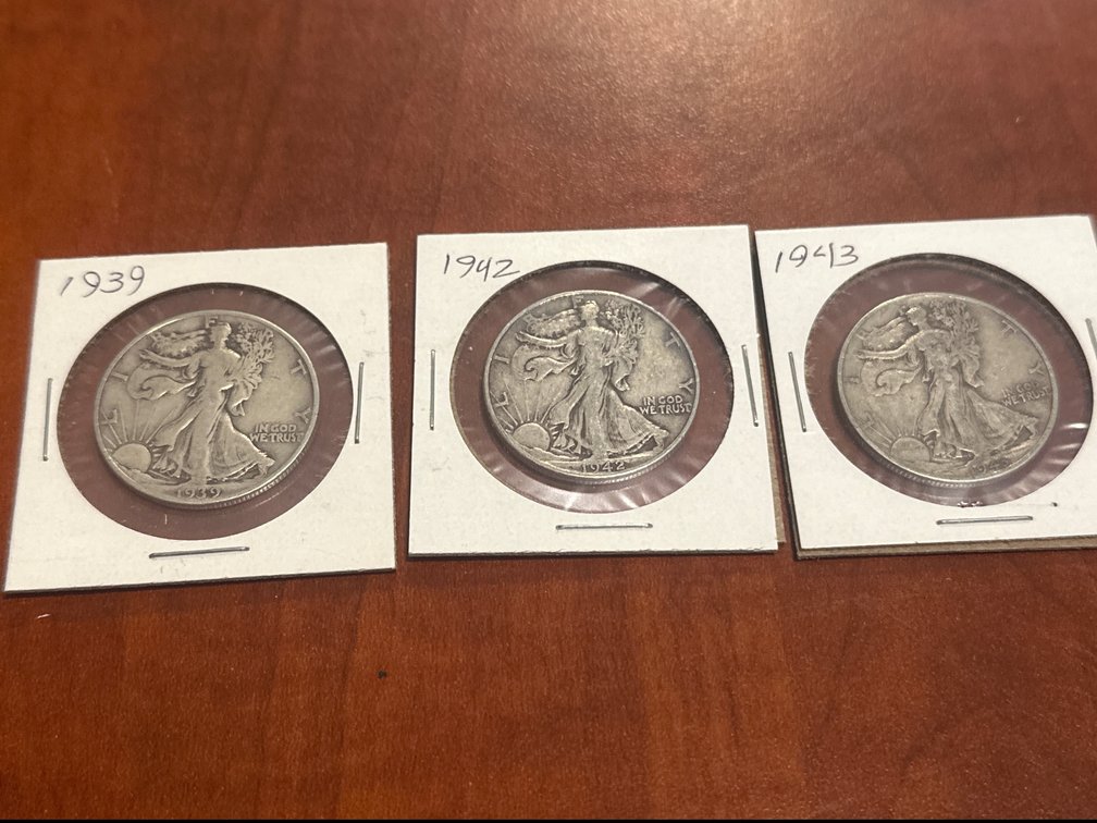 Three US minted silver walking liberty half dollars