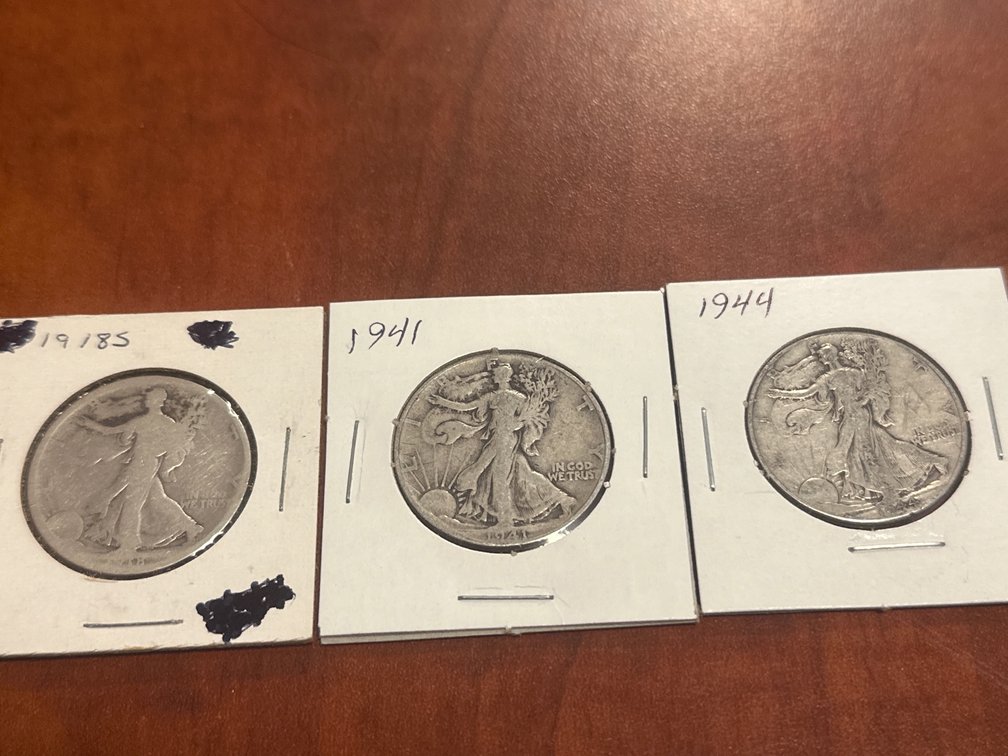 Three US minted silver walking liberty half dollars