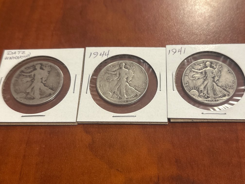 Three US minted silver walking liberty half dollars