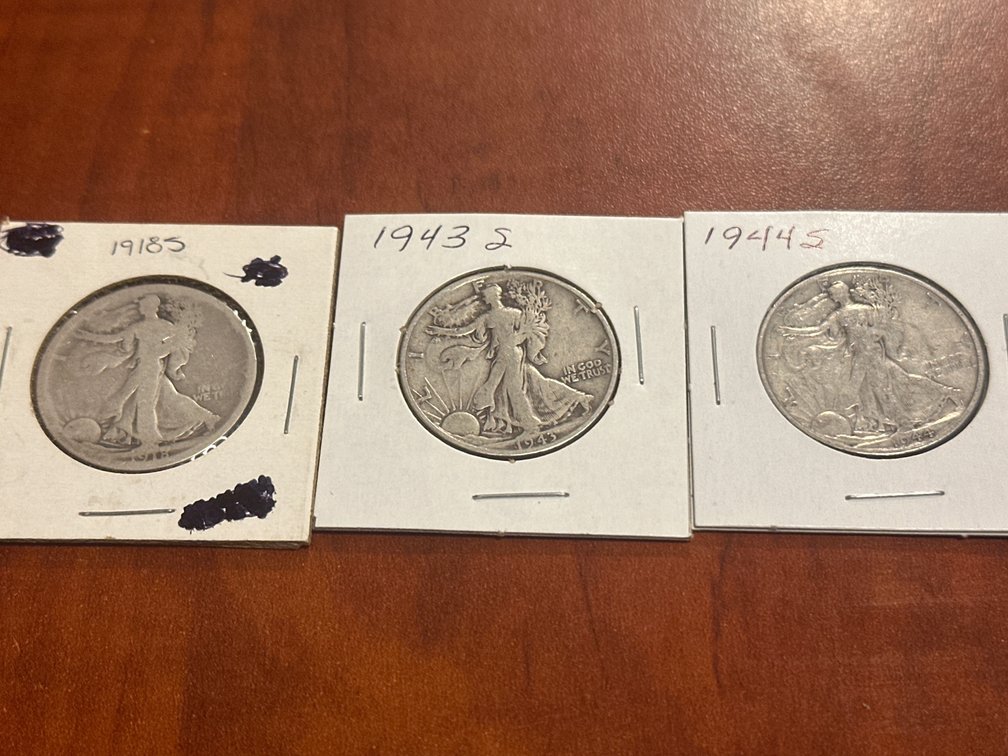 Three US minted walking liberty half dollars