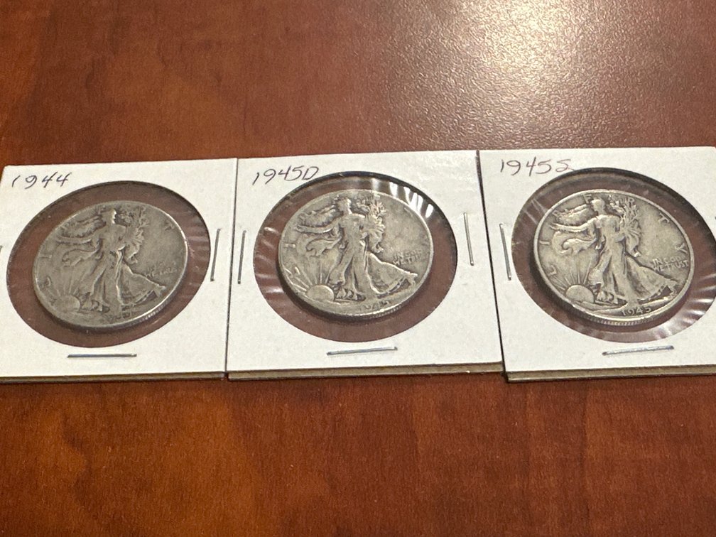 Three US minted silver walking liberty half dollars