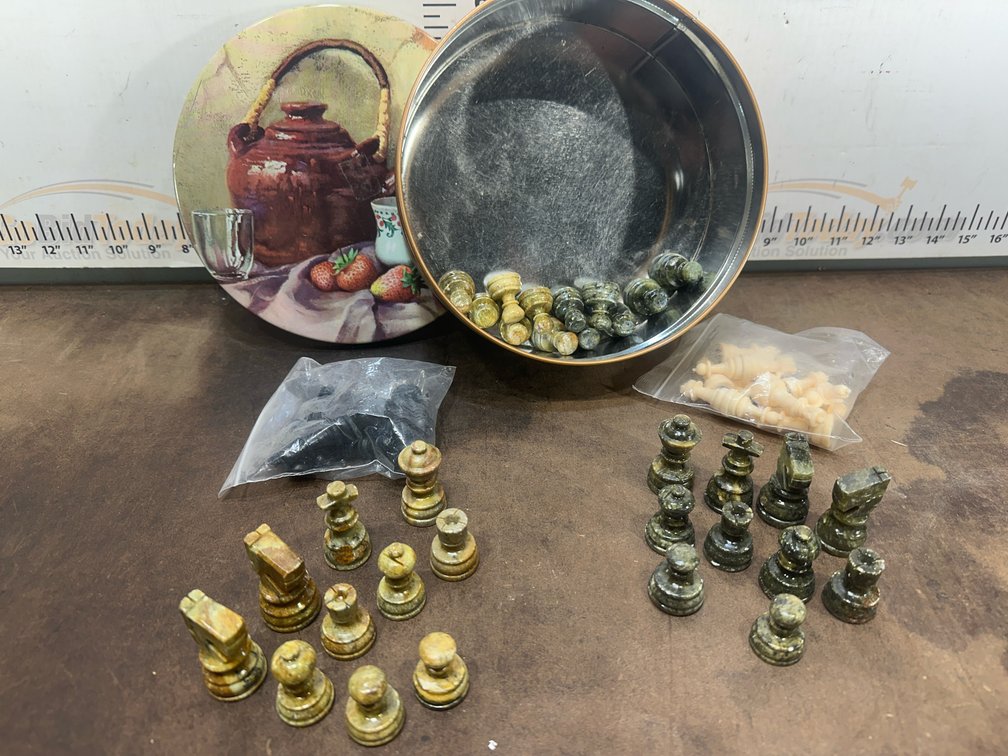 Carved Stone Chess Pieces, Decorative Metal Tin, and Plastic Pieces