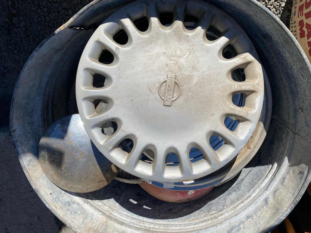 Galvanized Metal Tub with Hubcaps and Wheel Covers
