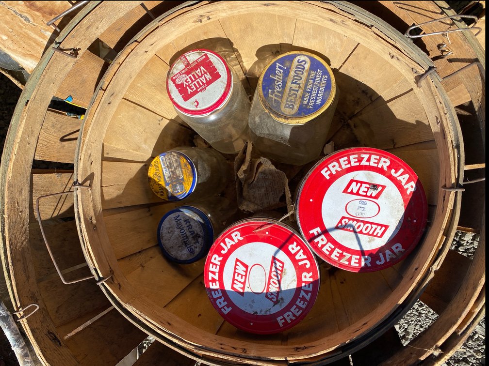Vintage Glass Food Jars with Metal Lids in Wooden Bushel Baskets
