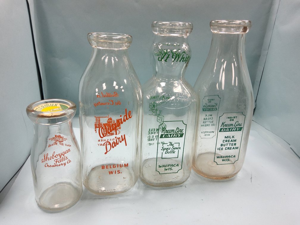 Four milk bottles