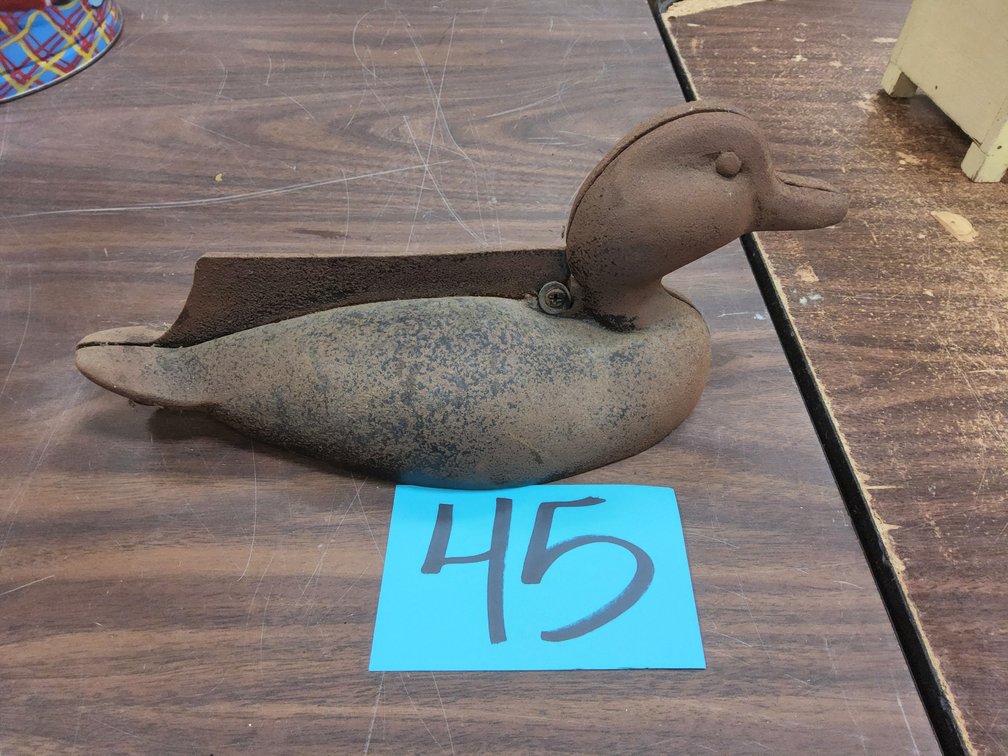 Cast iron duck boot scraper.
