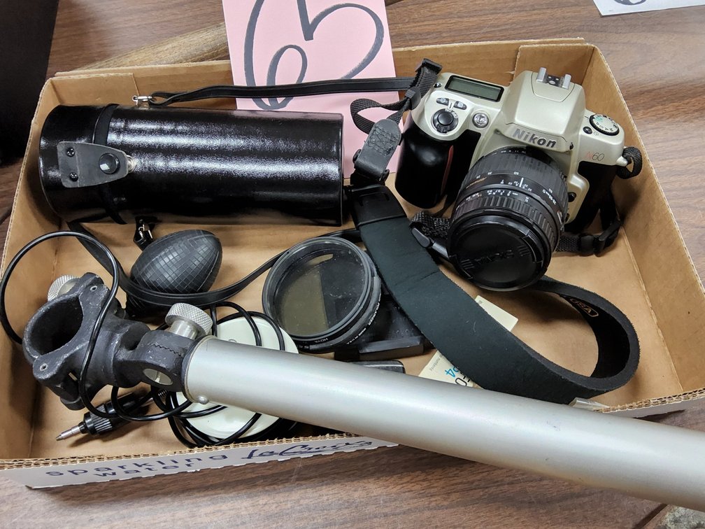 Nikon N60 35mm SLR camera with mounted 55mm lens