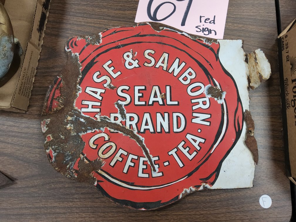 What's left of a Chase & Sanborn Seal Brand Coffee & Tea porcelain flange sign