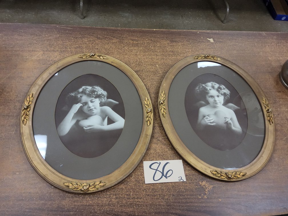 Matched pair of framed Cupid awake and asleep.