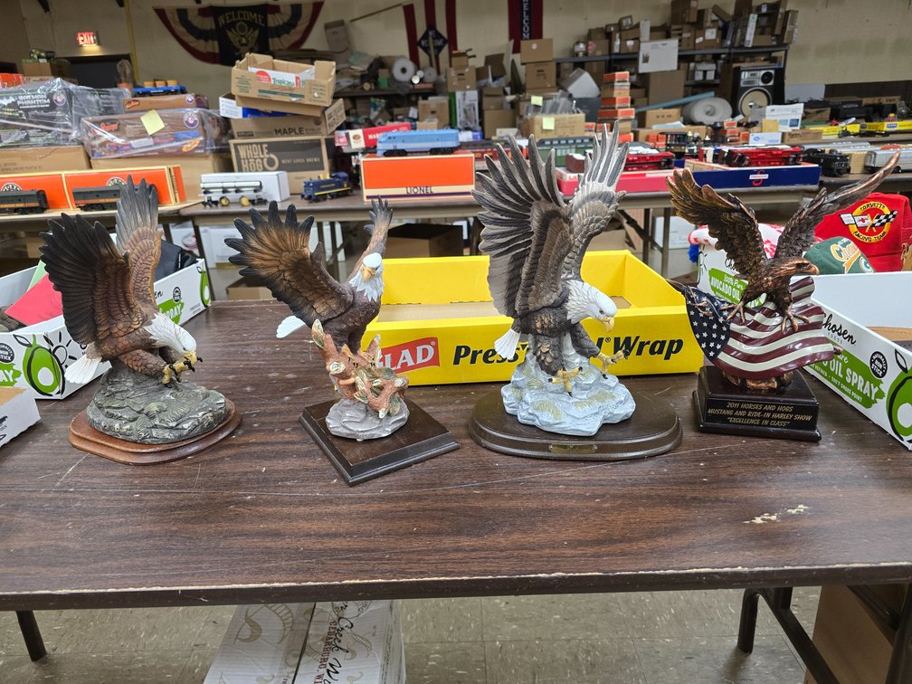 3 porcelain eagles and one metal one.