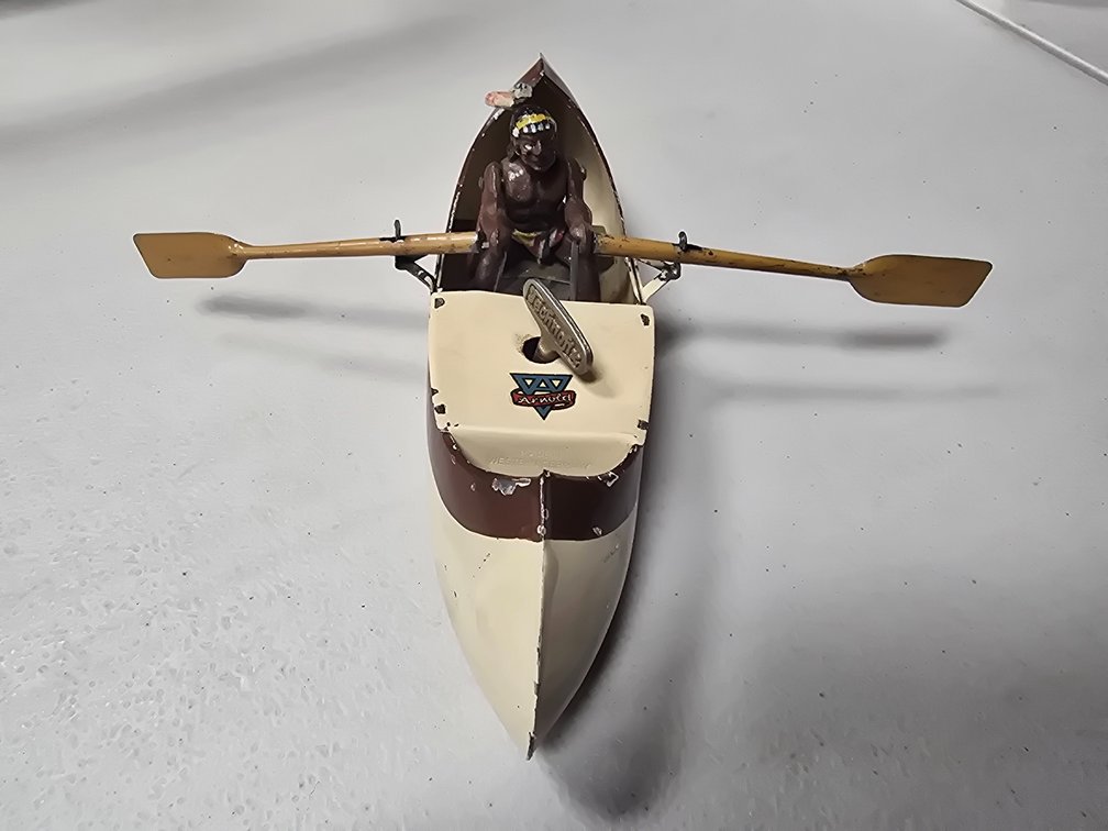 Arnold wind up Indian in canoe.