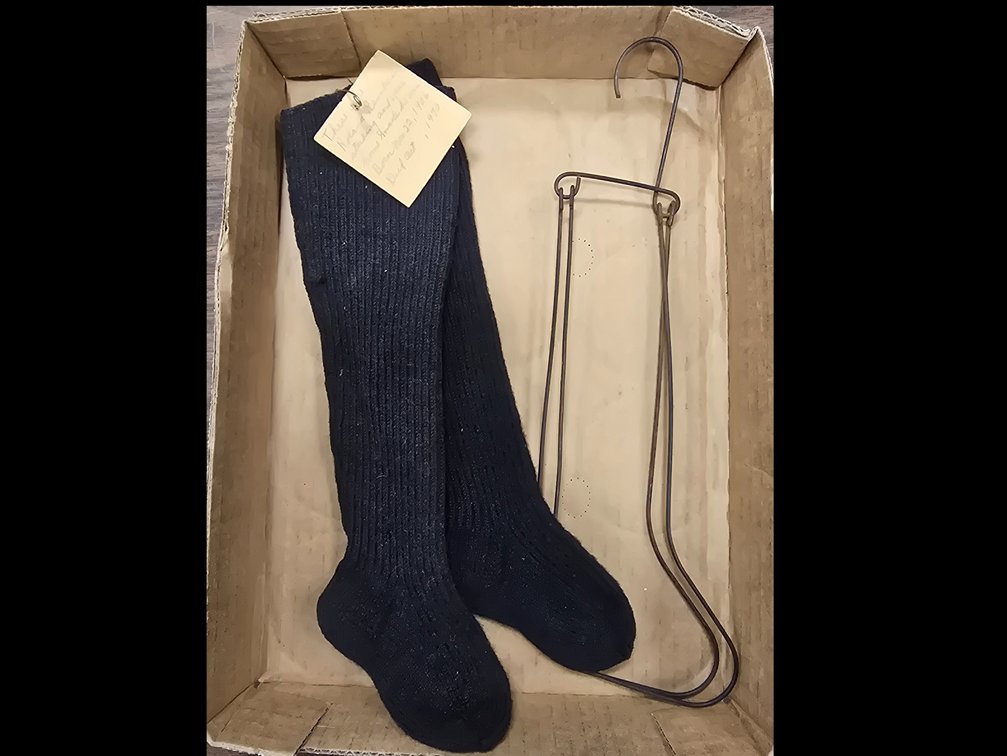 Homemade children's stockings and stretchers.