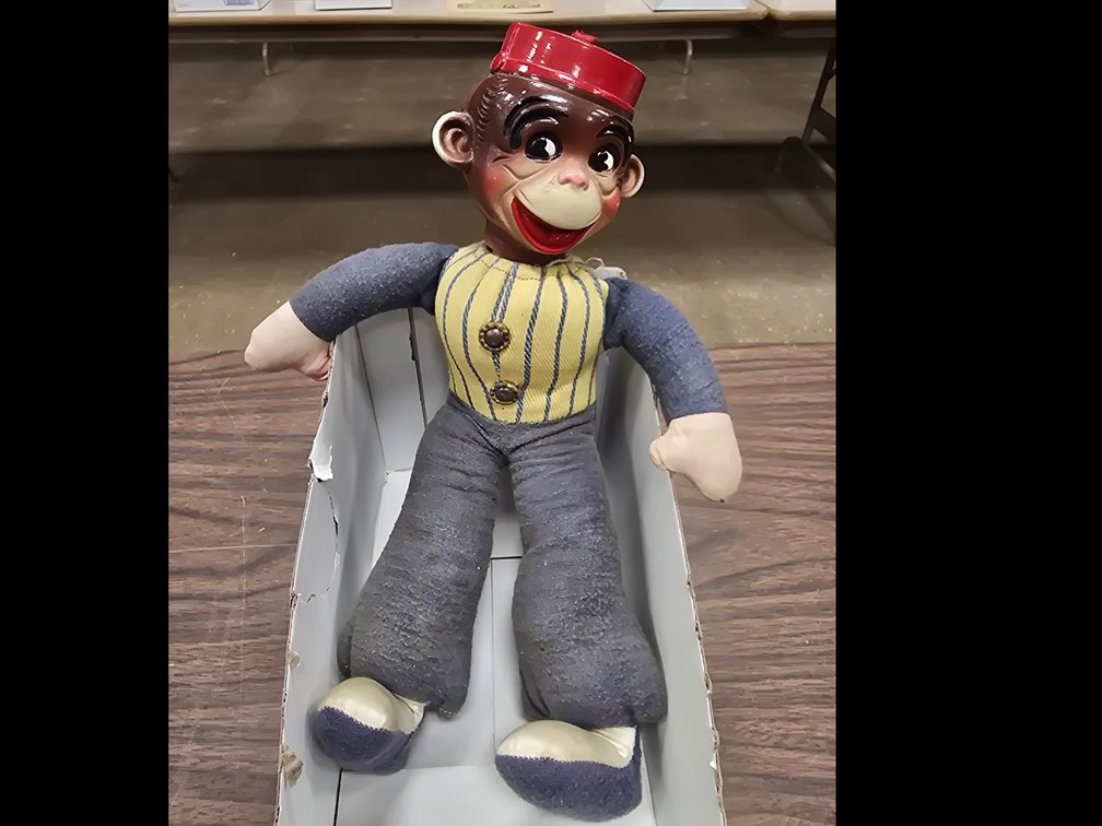 A very cheery bell hop monkey