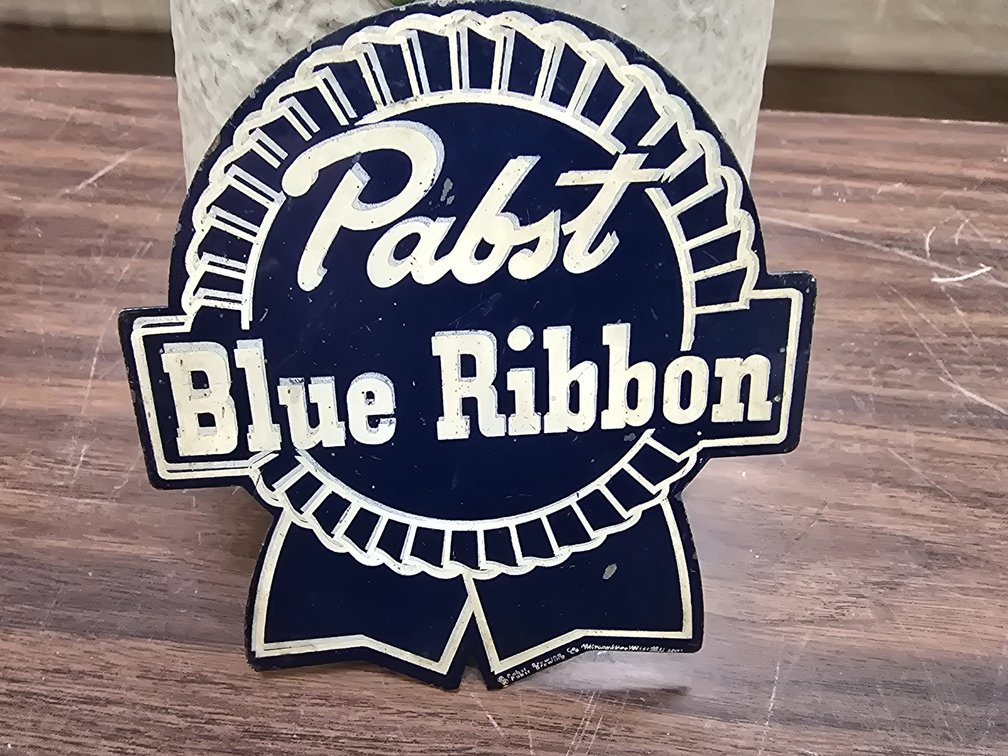 Die cut steel hanging Pabst logo.