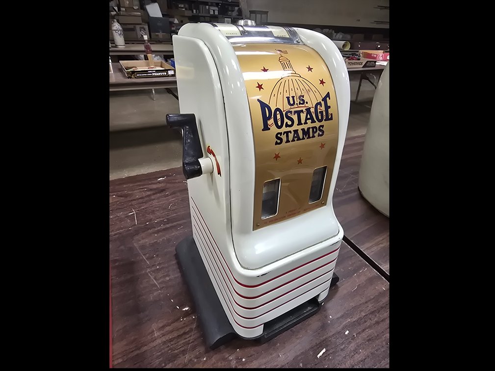 Coin-op postage vending machine by Northwestern Corp.