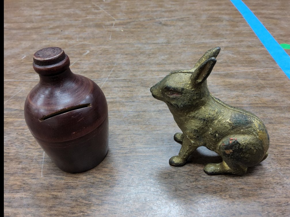 Cast iron rabbit and a wood jug bank