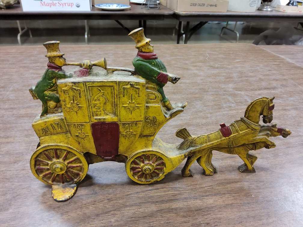Coach and two cast iron door stop