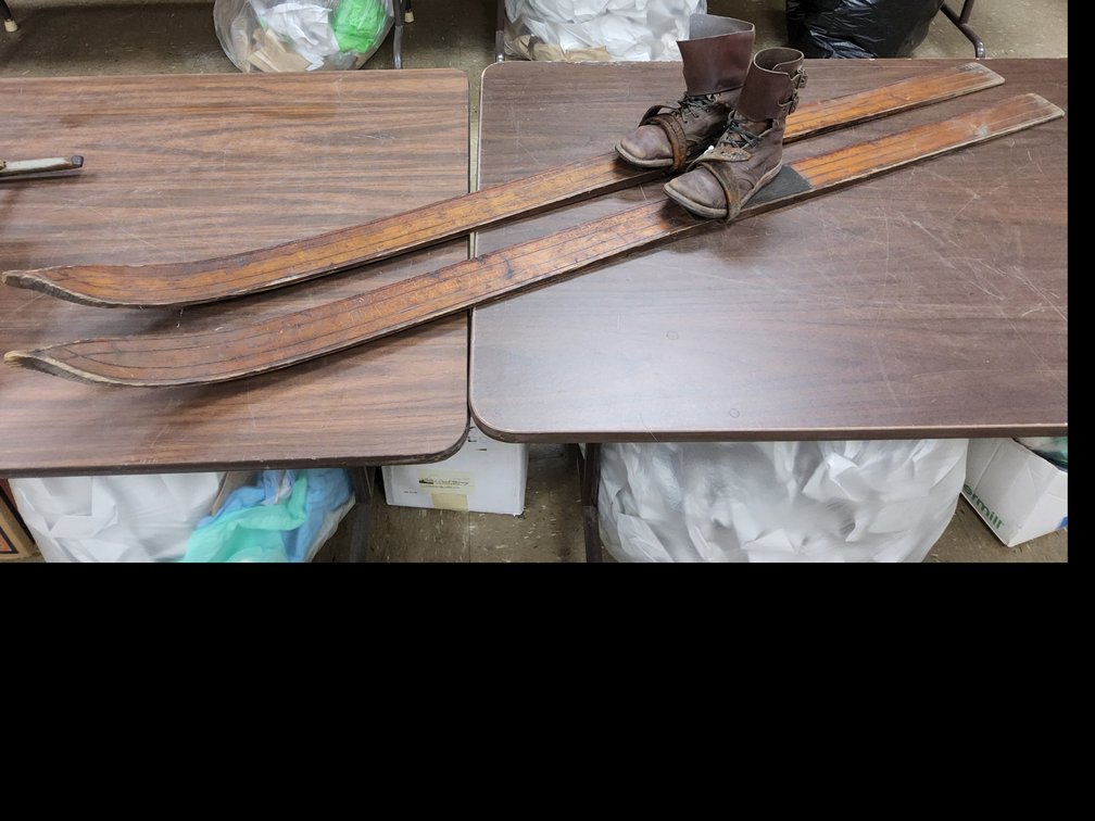 A pair of child's skis with boots