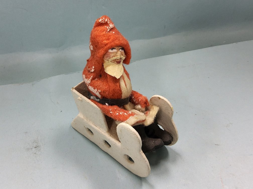 Clay face Santa in putz sled