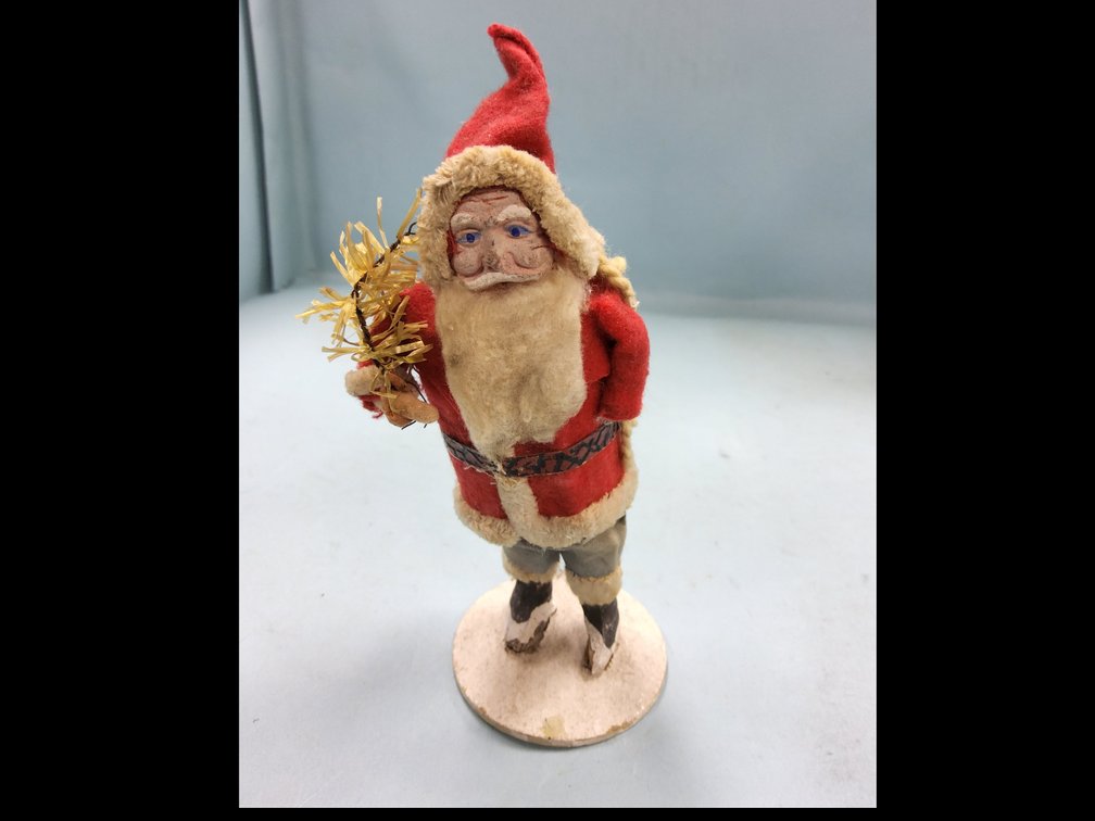 Clay face Santa with tree and sack